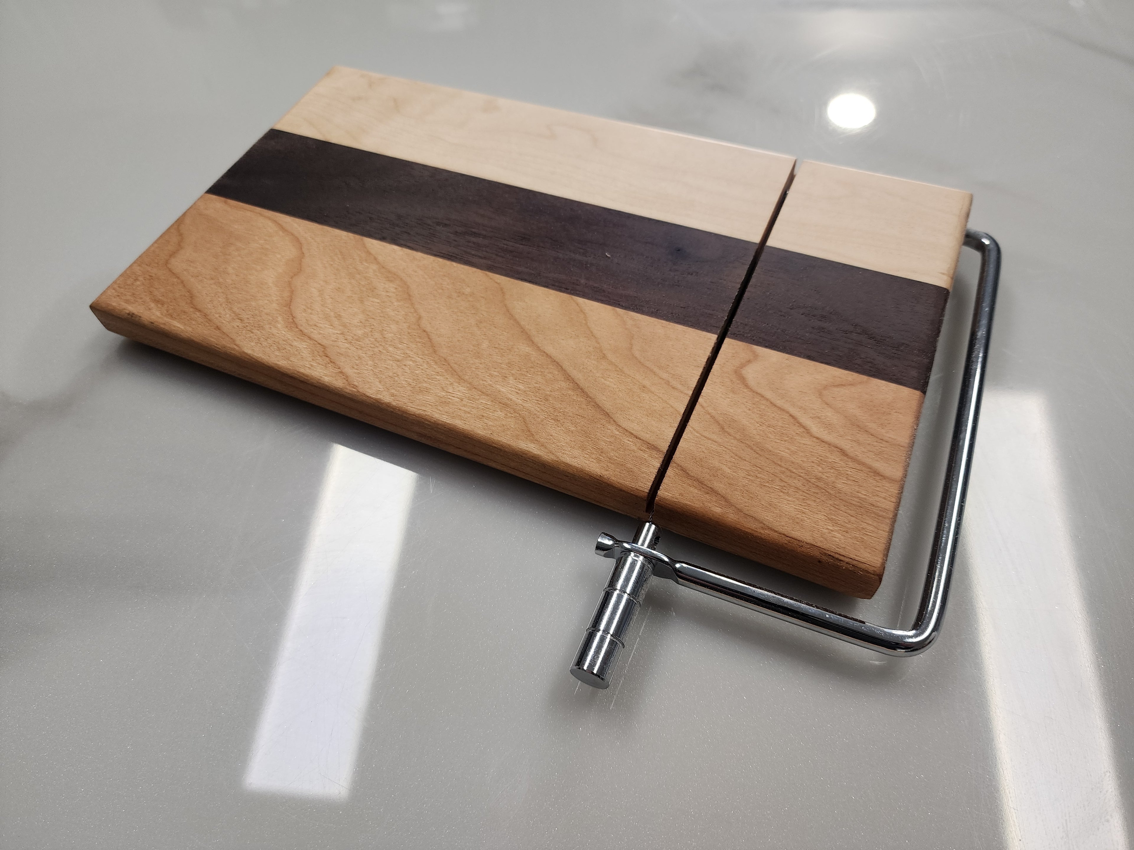 Edge grain cheese slicing board